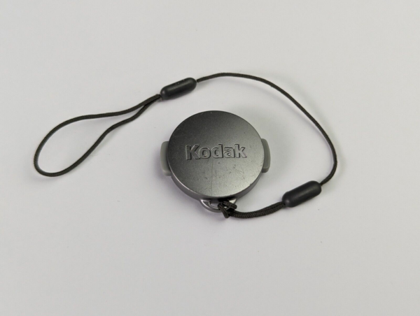 Kodak Lens Cap from Kodak Easy Share CX4310 21mm Camera + Strap